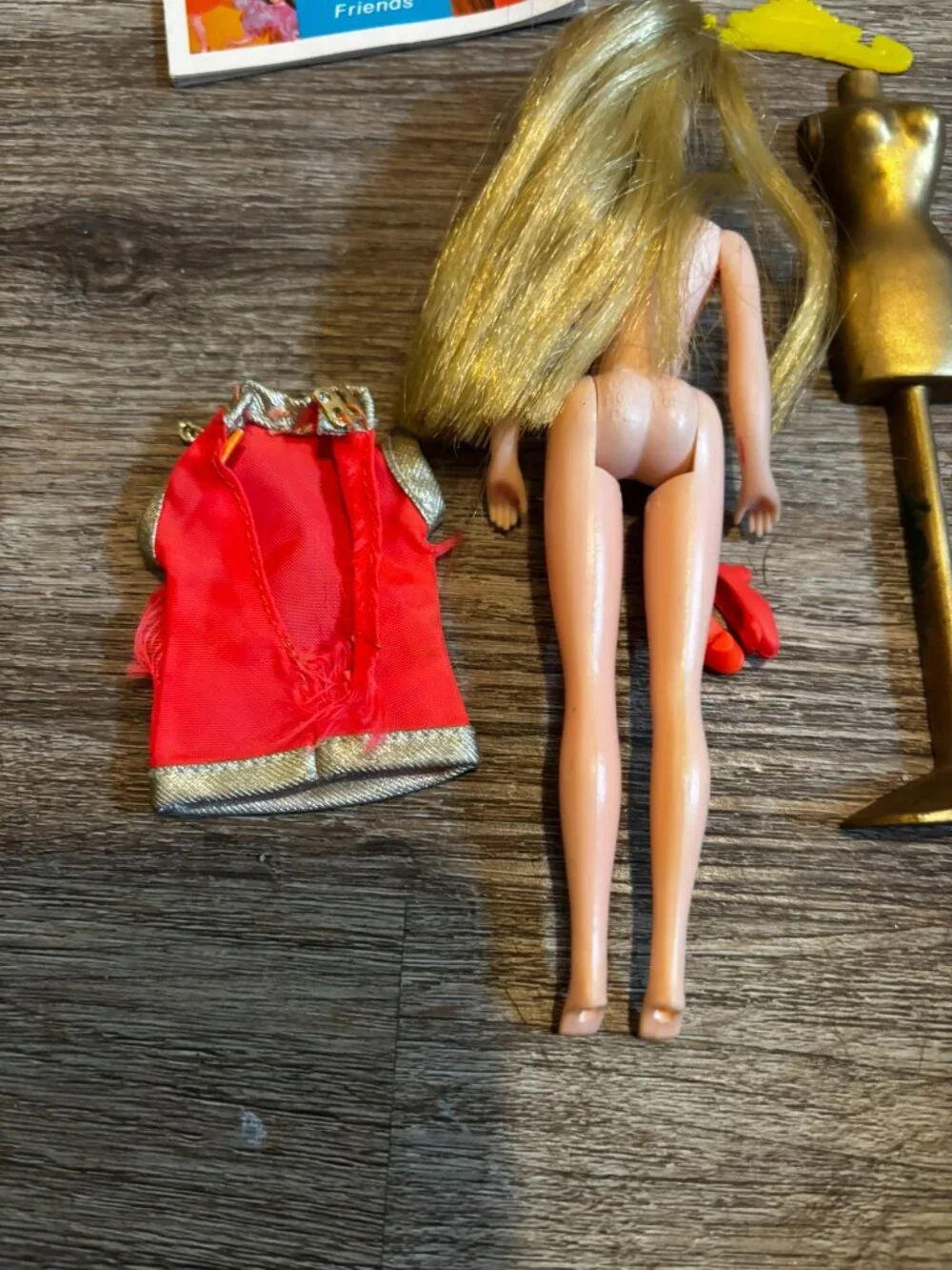 Topper Dawn Fancy Feet doll wearing orange and silver straight hard legs